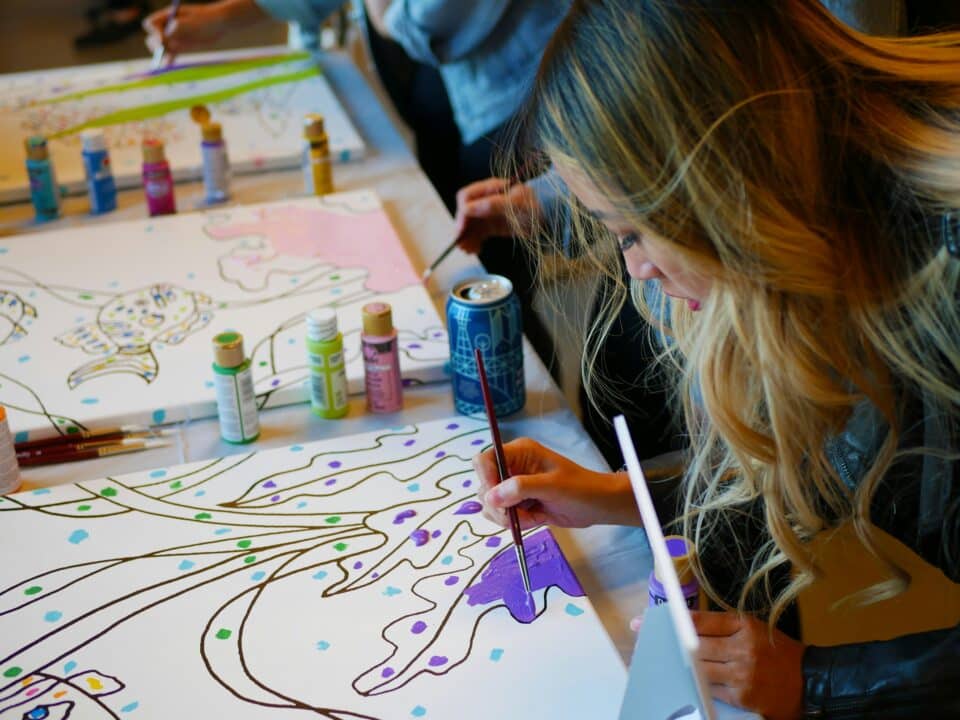 Women painting purple under the sea